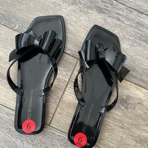 BCBGeneration Black Gloss Bow Slide Sandals